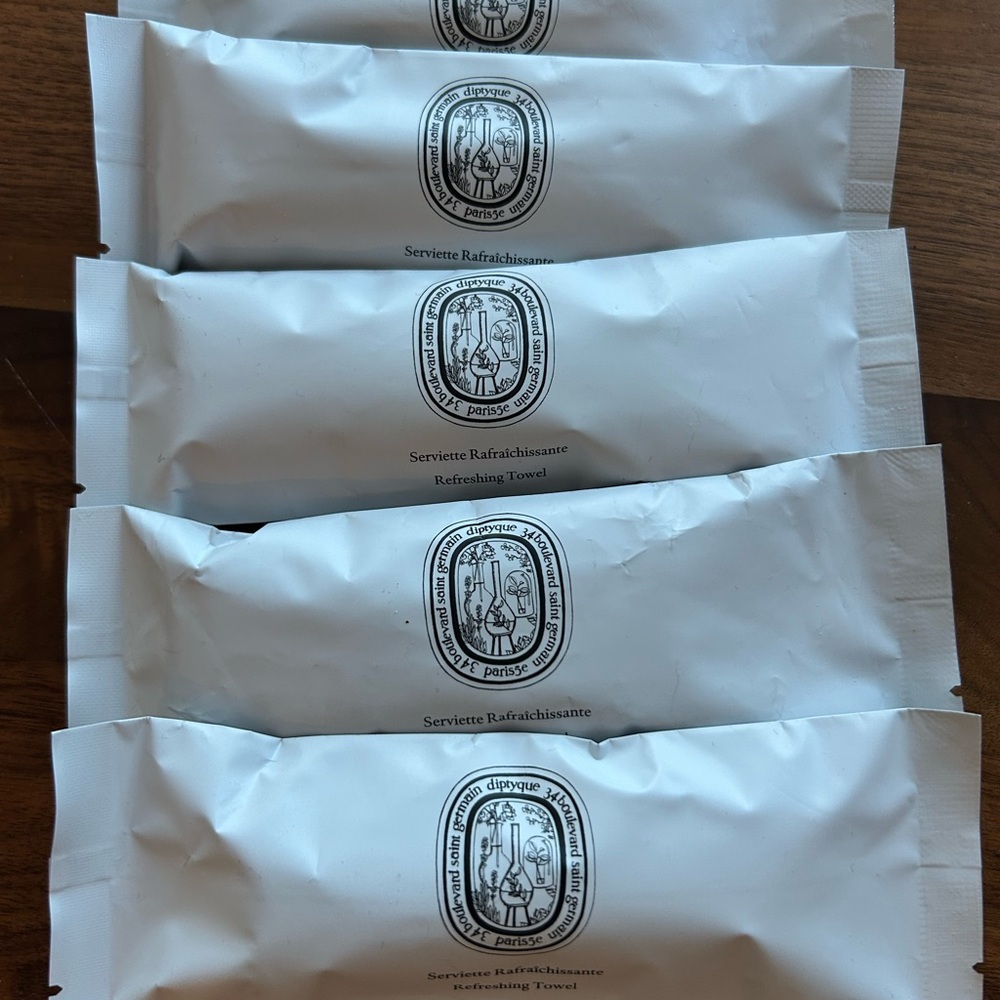 Five Diptyque Scented Refreshing Towelettes